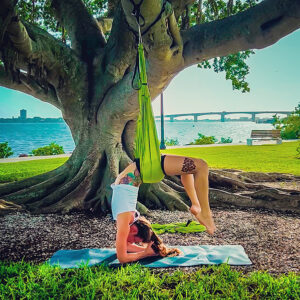 Jessica Blom teaching Aerial Yoga at The Yoga Barre LWR – RYT 500 instructor and Heartwood Yoga Institute graduate specializing in restorative and aerial yoga in Lakewood Ranch, FL.